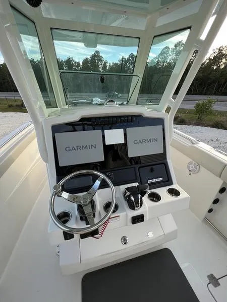 Slide: The Image of 2022 Sailfish 272 CC boat helm with Garmin navigation system. - 16