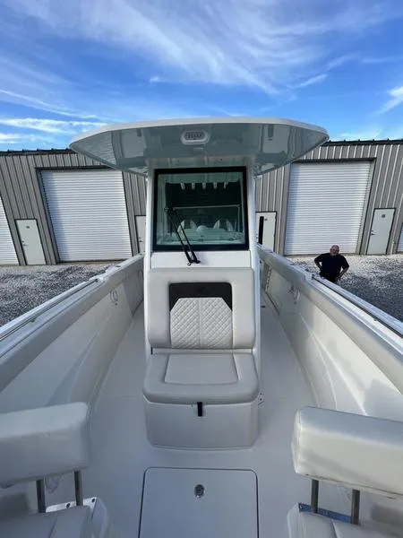 Slide: The Image of 2022 Sailfish 272 CC center console boat with cushioned seating and storage. - 21