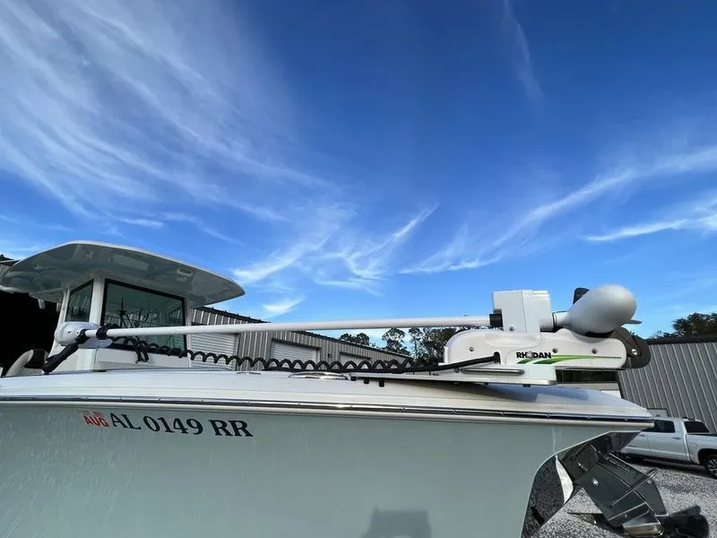 Slide: The Image of 2022 Sailfish 272 CC boat with registration number AL 0149 RR under a clear blue sky. - 6