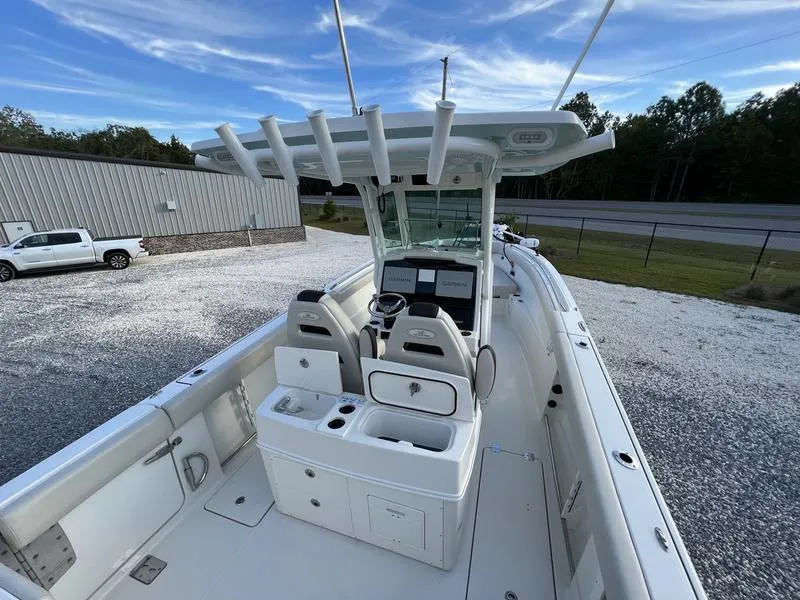 Slide: The Image of 2022 Sailfish 272 CC center console boat with dual seats and modern dashboard. - 9