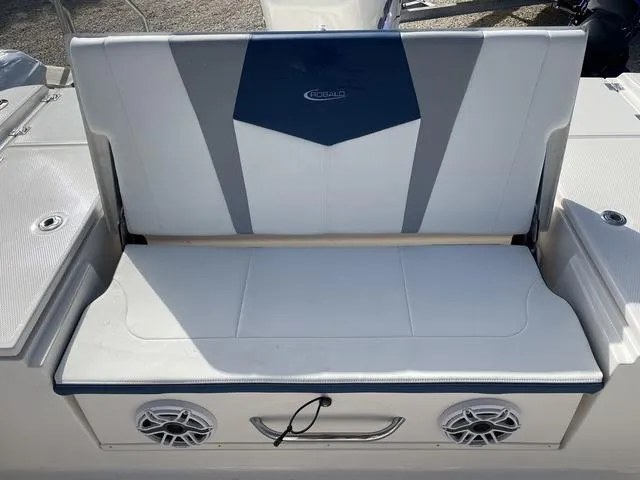 Slide: The Image of 2023 Robalo 266 Cayman boat seating with built-in speakers. - 10