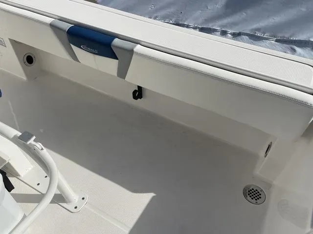 Slide: The Image of 2023 Robalo 266 Cayman boat interior, white seating and deck. - 13
