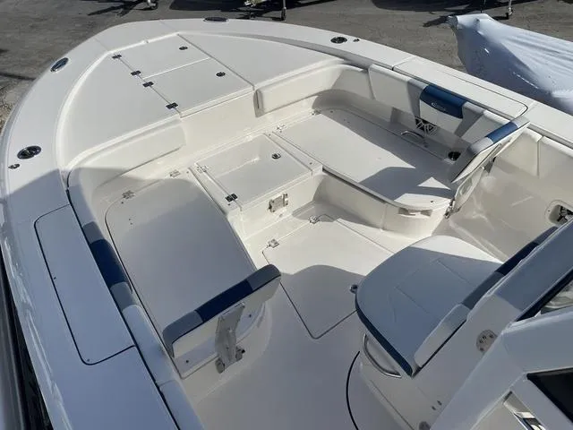 Slide: The Image of 2023 Robalo 266 Cayman boat interior with seating and storage compartments. - 15