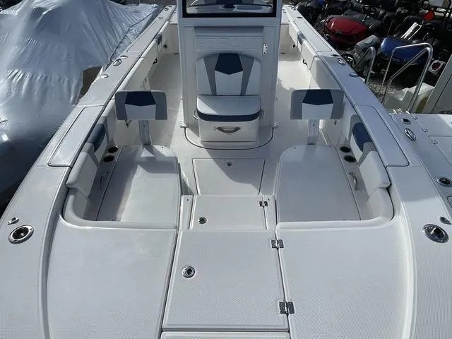 Slide: The Image of 2023 Robalo 266 Cayman boat interior with seating and storage compartments. - 18
