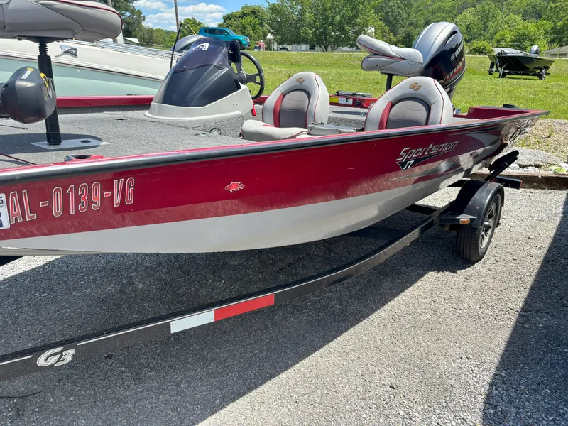 Slide: The Image of 2018 G3 Sportsman 1710 boat with red and gray design on a trailer. - 10