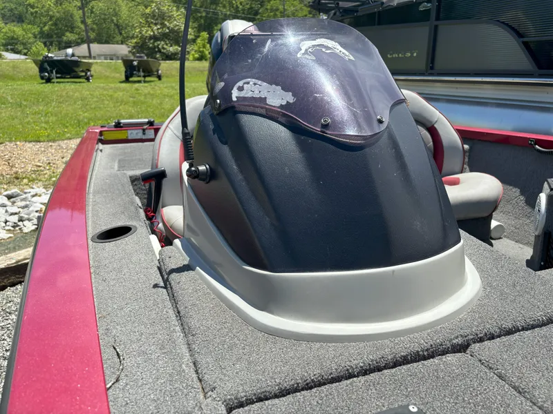 Slide: The Image of 2018 G3 Sportsman 1710 boat interior with seating and console, outdoors. - 14