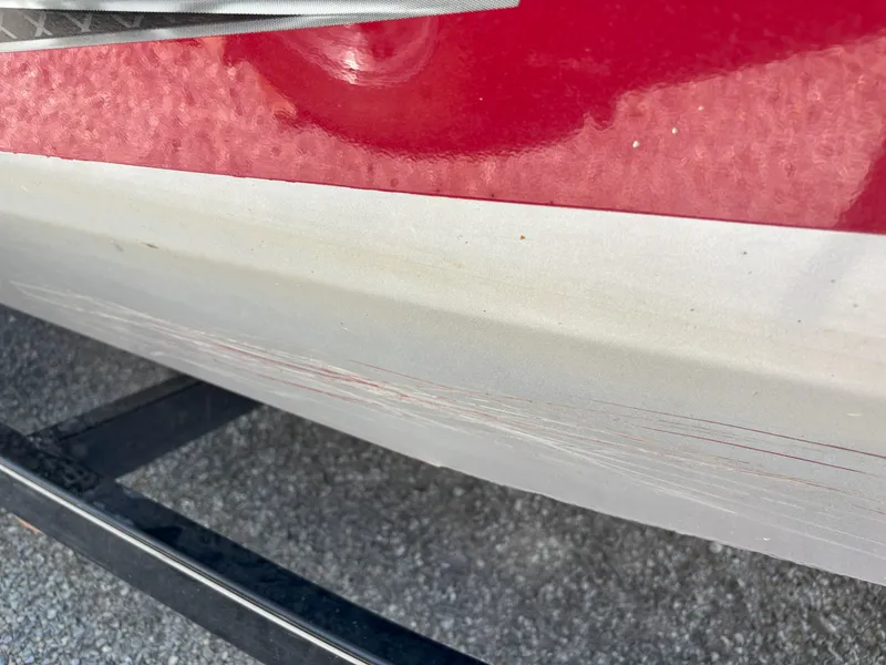 Slide: The Image of 2018 G3 Sportsman 1710 boat with visible scratches on the hull. - 17