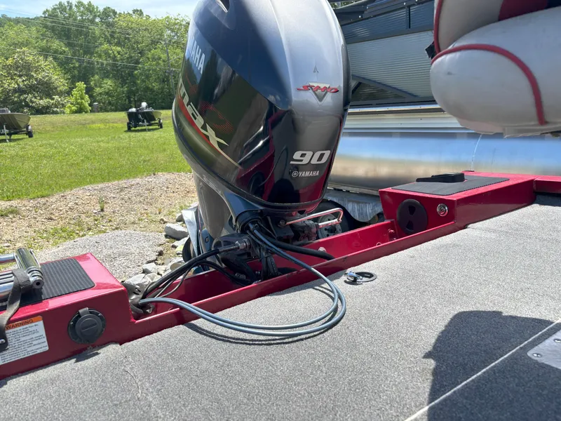 Slide: The Image of 2018 G3 Sportsman 1710 boat with Yamaha 90 engine, red deck, outdoor setting. - 19