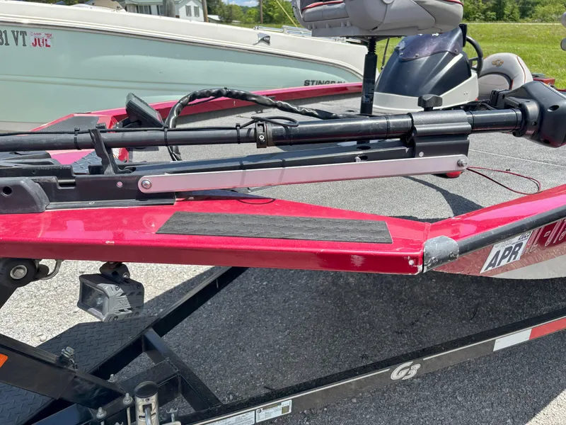 Slide: The Image of 2018 G3 Sportsman 1710 boat with red exterior and mounted equipment on trailer. - 2