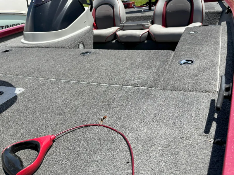 Slide: The Image of 2018 G3 Sportsman 1710 boat interior with gray carpet and seating. - 4