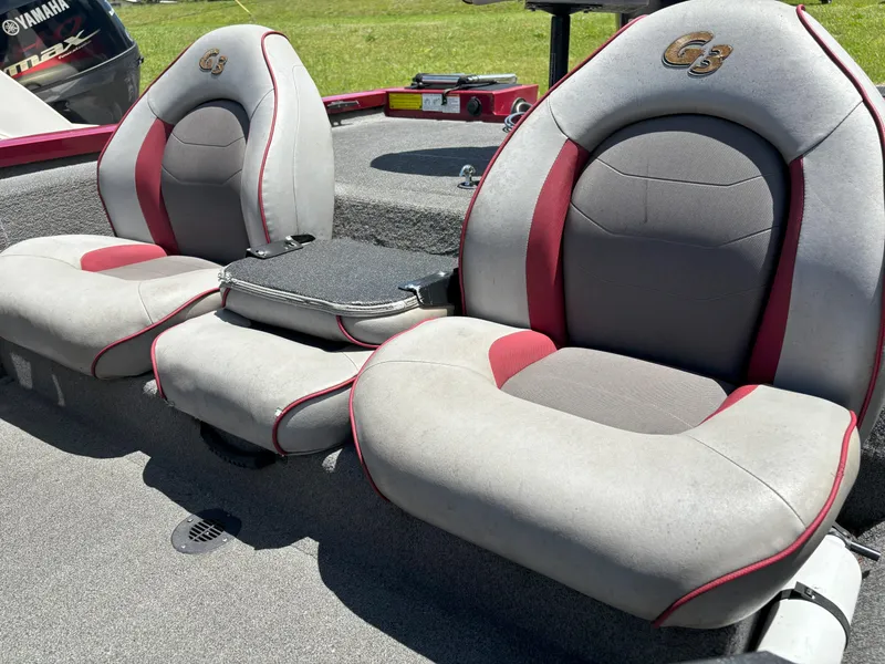 Slide: The Image of 2018 G3 Sportsman 1710 boat seats with red and gray upholstery. - 5