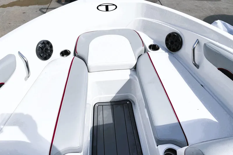 Slide: The Image of 2023 Tahoe 210 Si Limited boat interior with white seating and speakers. - 8