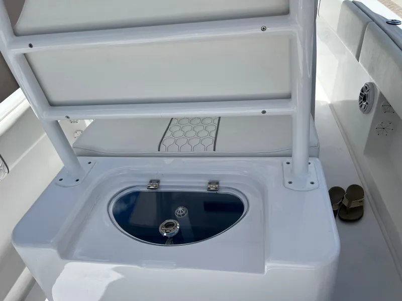 Slide: The Image of 1979 Wellcraft Scarab Sport 302 boat interior with seating and storage compartment. - 14