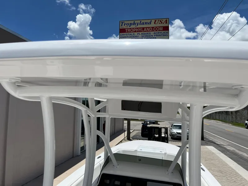 Slide: The Image of 1979 Wellcraft Scarab Sport 302 boat with T-top, parked outside Trophyland USA. - 16