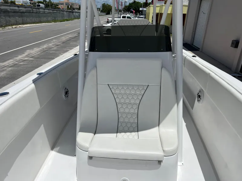 Slide: The Image of 1979 Wellcraft Scarab Sport 302 boat interior with white seating and console. - 24