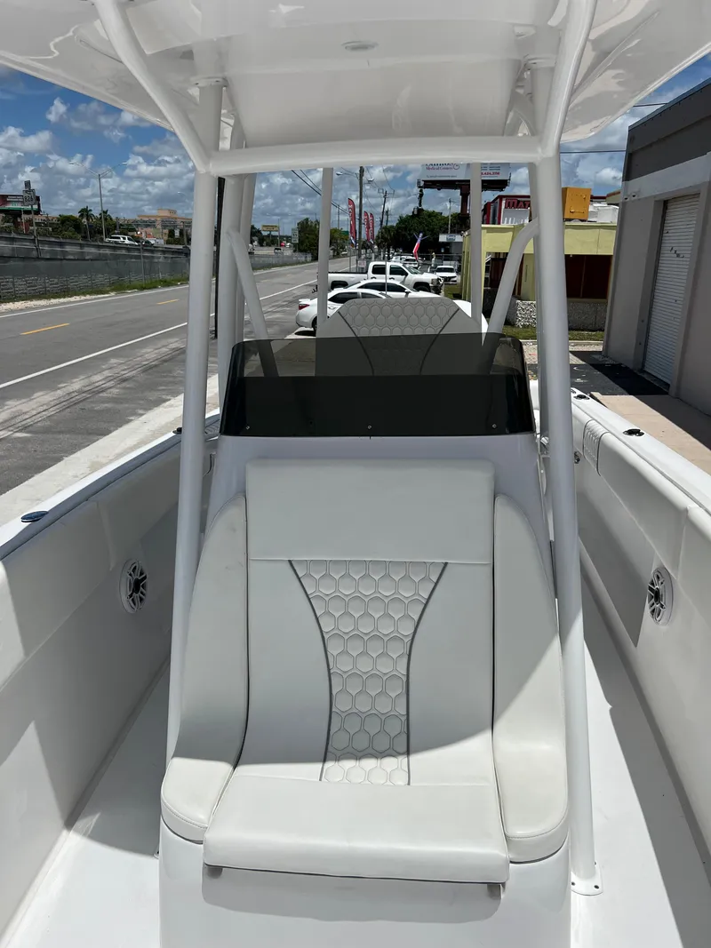 Slide: The Image of 1979 Wellcraft Scarab Sport 302 boat with white seating and console. - 25