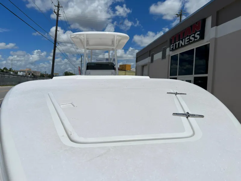 Slide: The Image of 1979 Wellcraft Scarab Sport 302 boat near Titan Fitness under a clear blue sky. - 28