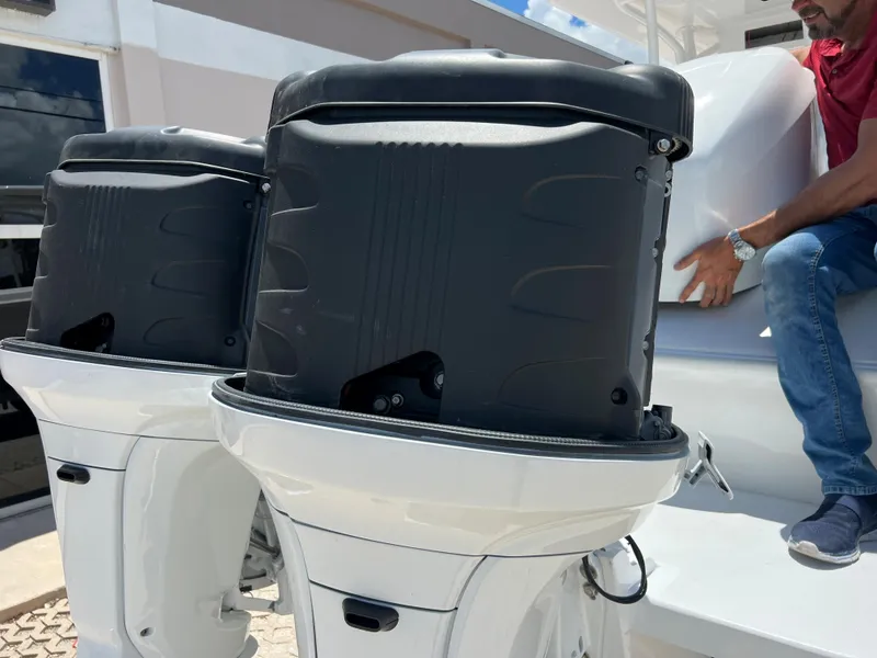 Slide: The Image of Close-up of twin outboard motors on a 1979 Wellcraft Scarab Sport 302 boat. - 36
