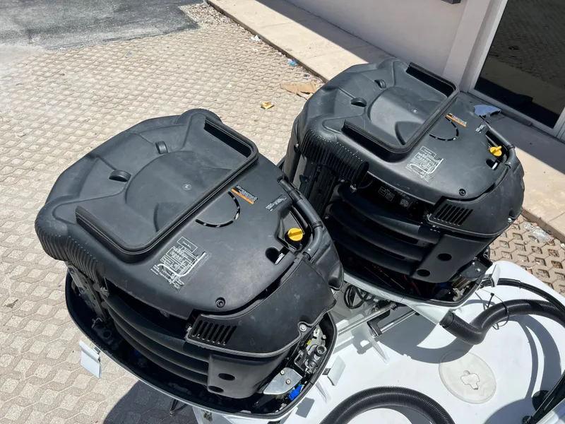 Slide: The Image of Twin outboard engines on a 1979 Wellcraft Scarab Sport 302 boat. - 38