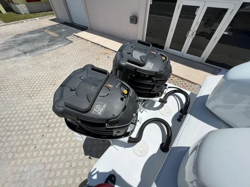 Slide: The Image of 1979 Wellcraft Scarab Sport 302 boat engines in a parking lot. - 39