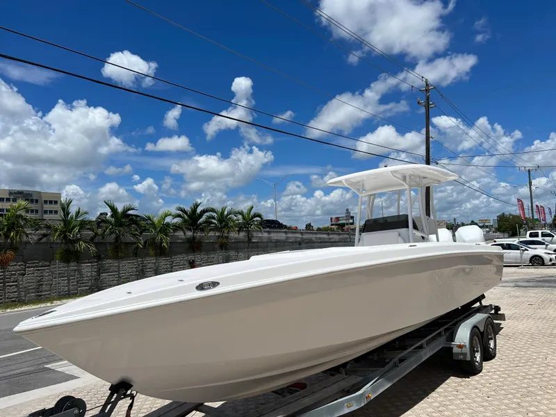 Slide: The Image of 1979 Wellcraft Scarab Sport 302 boat on trailer under blue sky. - 6
