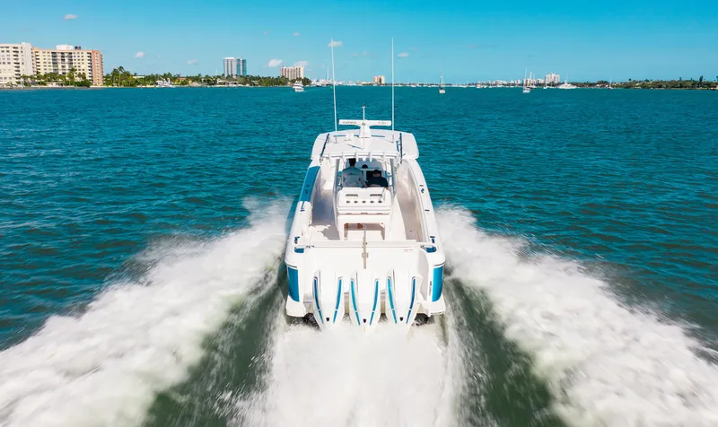 Slide: The Image of 2021 Intrepid 407 Nomad FE cruising on open water. - 17