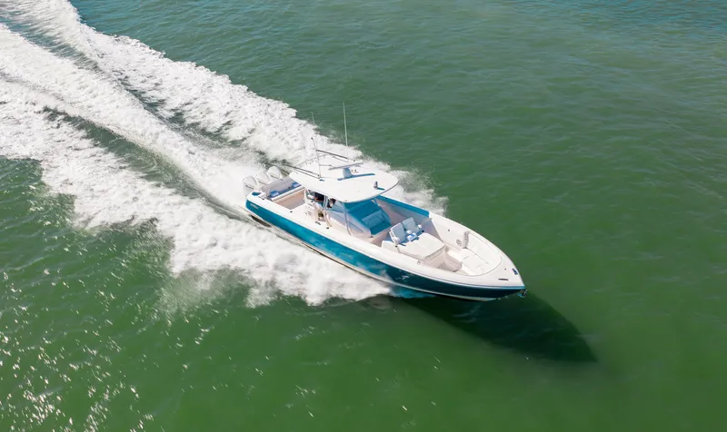 Slide: The Image of 2021 Intrepid 407 Nomad FE cruising on open water. - 18