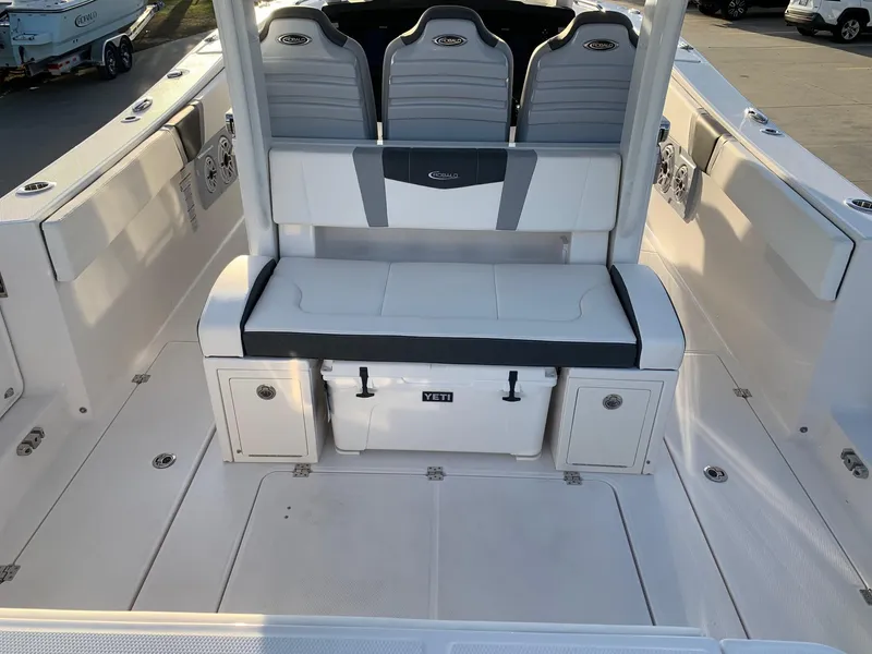 Slide: The Image of 2024 Robalo R360 boat interior with seating and storage compartments. - 7
