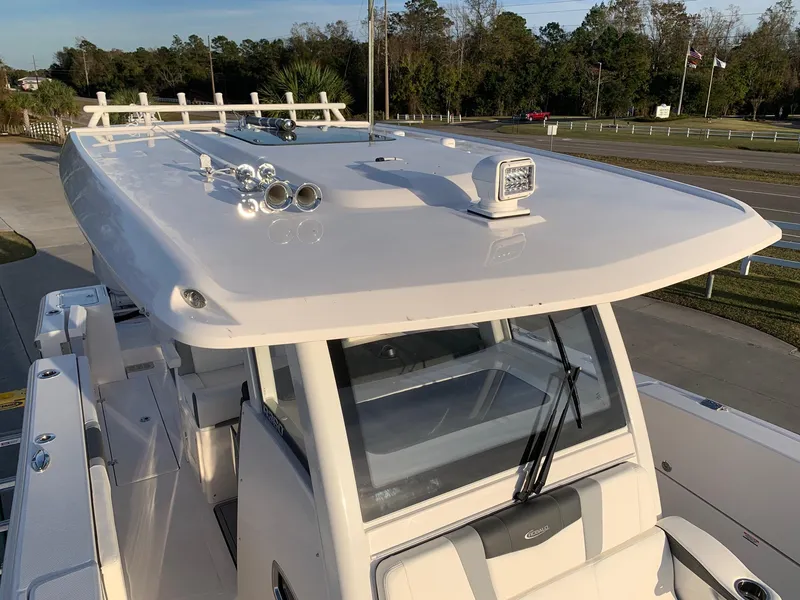 Slide: The Image of 2024 Robalo R360 boat with sleek white exterior and modern design. - 8