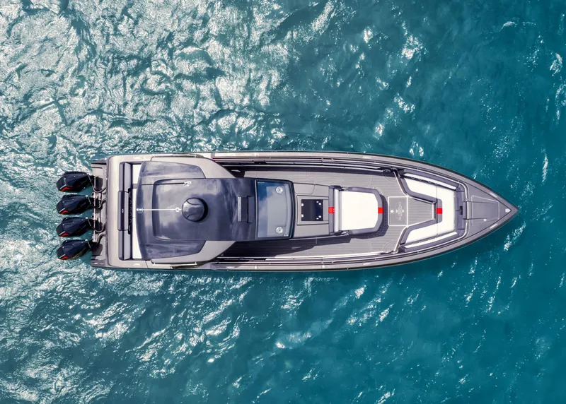 Slide: The Image of Aerial view of 2025 Cigarette 41 Nighthawk boat on blue water. - 13