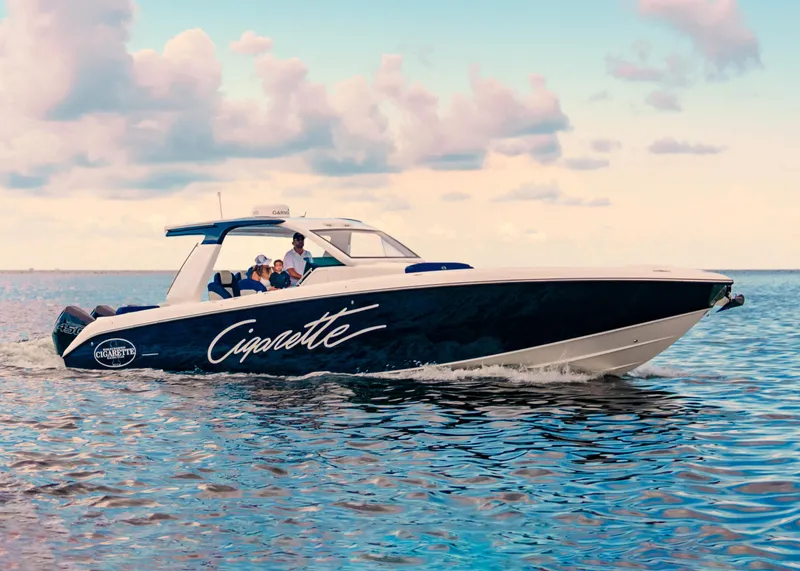 Slide: The Image of 2025 Cigarette 41 Nighthawk boat cruising on open water. - 14