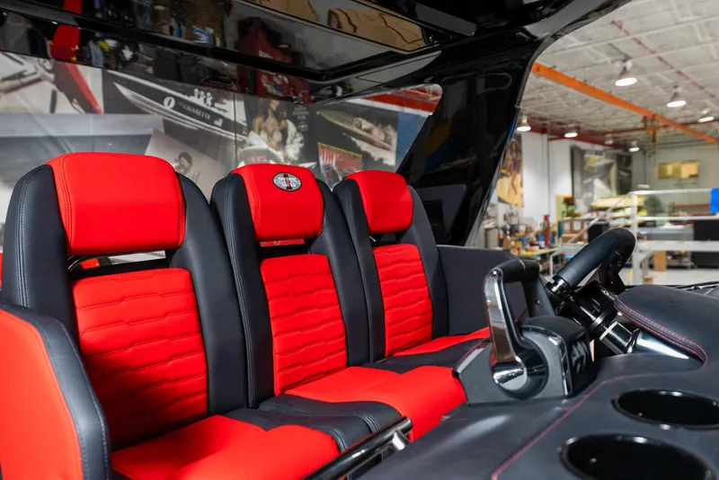 Slide: The Image of Interior of 2025 Cigarette 41 Nighthawk with red and black seats. - 25