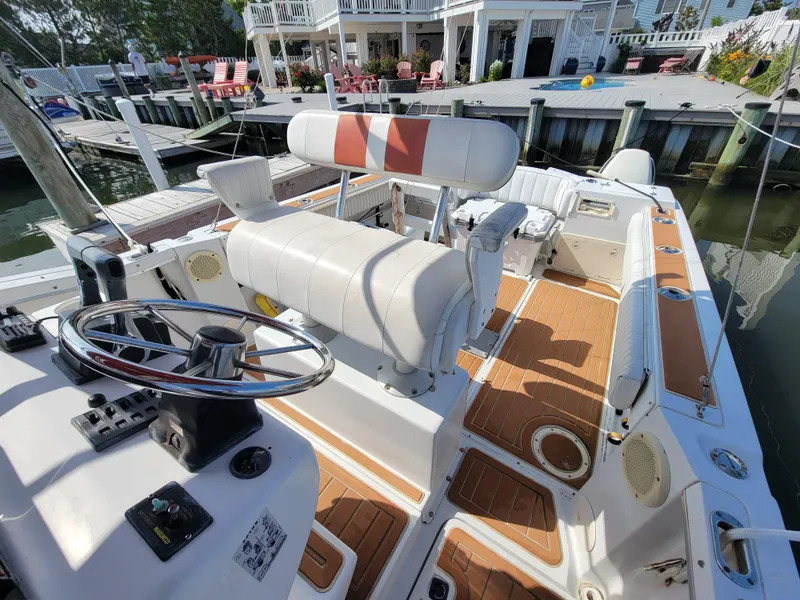 Slide: The Image of 1997 Glacier Bay 260 Canyon Runner boat interior at dock. - 12