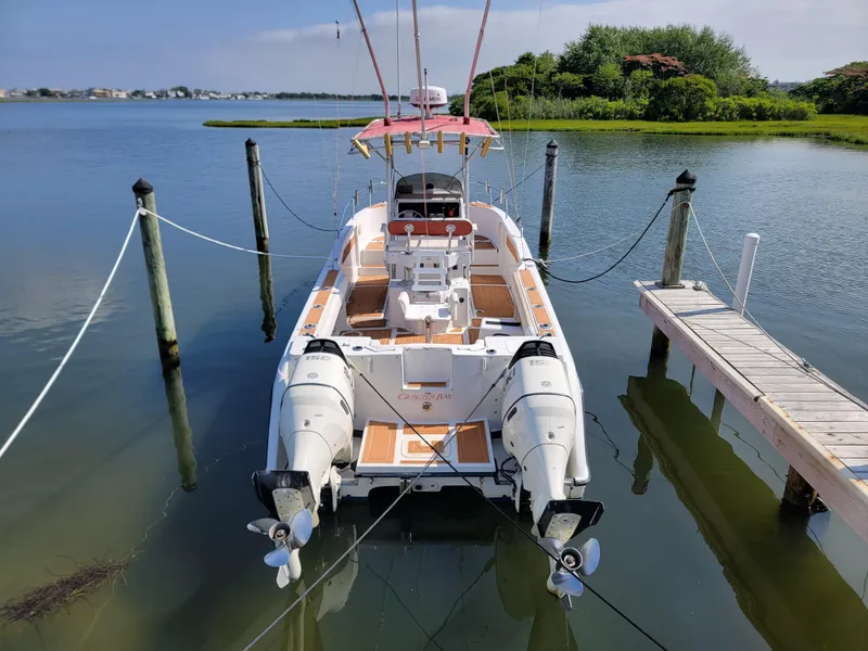 Slide: The Image of 1997 Glacier Bay 260 Canyon Runner docked in calm waters. - 8