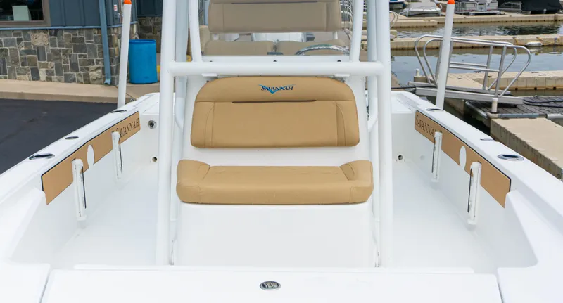 Slide: The Image of 2023 Savannah 220 IS boat interior with tan seating and white frame. - 10