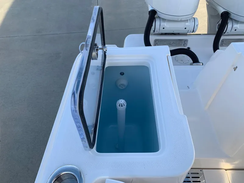 Slide: The Image of 2024 Robalo R360 livewell with open lid and dual outboard motors. - 14