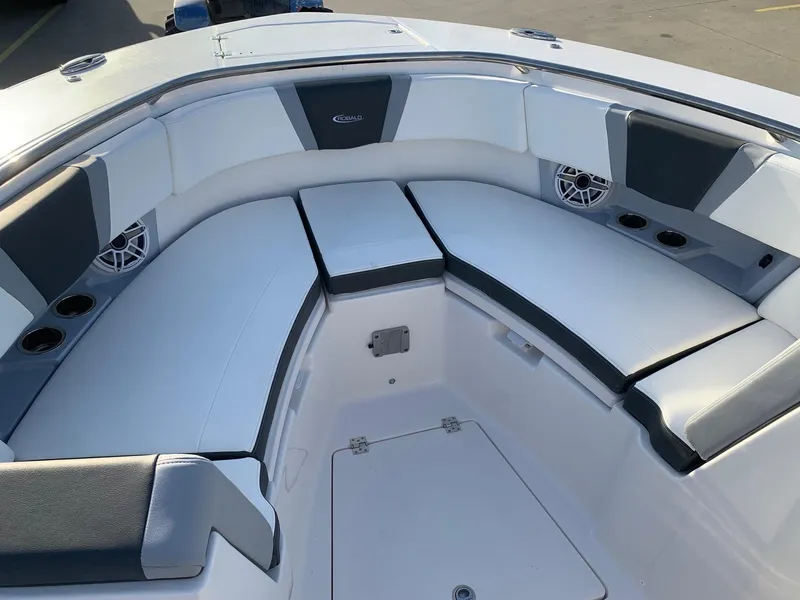 Slide: The Image of 2024 Robalo R360 boat with spacious cushioned seating area. - 27