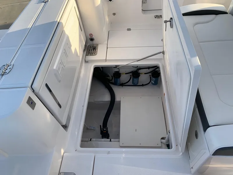 Slide: The Image of 2024 Robalo R360 boat interior with open storage compartment. - 7