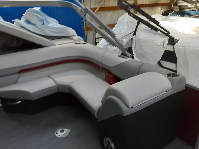 Slide: The Image of 2023 Lowe SS 230 boat interior with gray and red seating. - 10