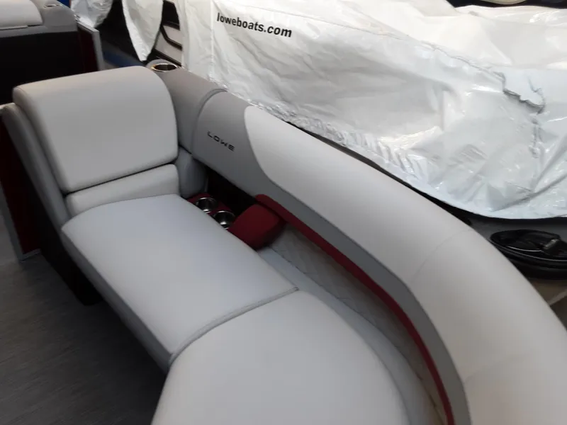 Slide: The Image of 2023 Lowe SS 230 boat interior with gray and red cushioned seating. - 4