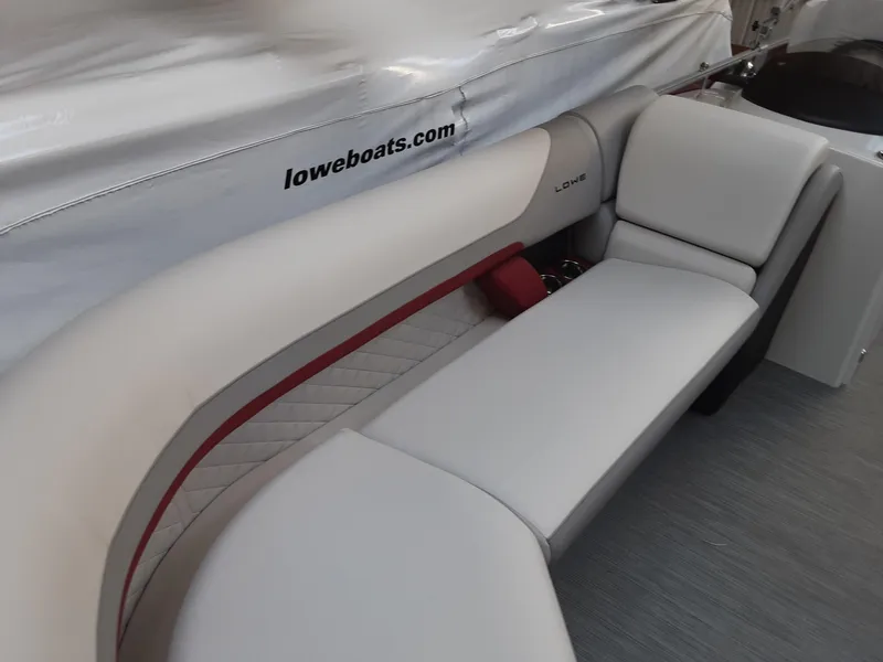 Slide: The Image of 2023 Lowe SS 230 boat interior with plush seating. - 5