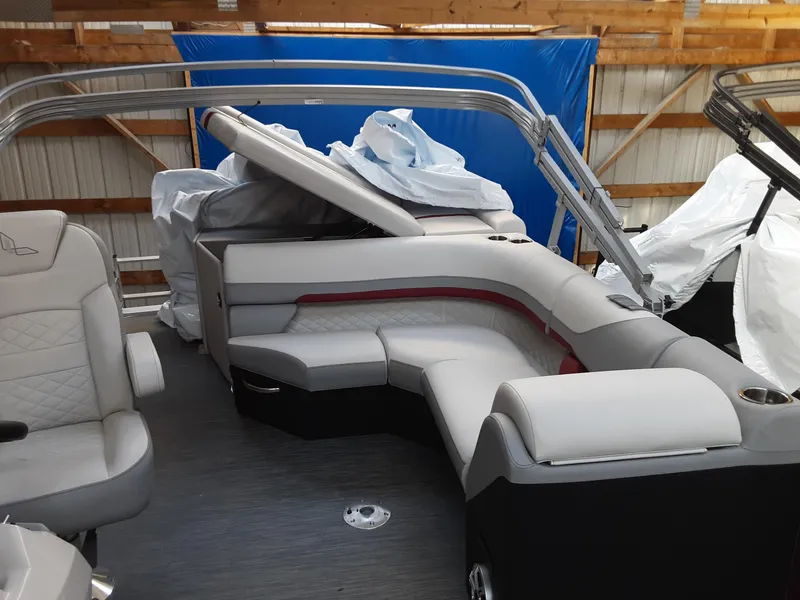 Slide: The Image of 2023 Lowe SS 230 pontoon boat interior with gray and red seating. - 9