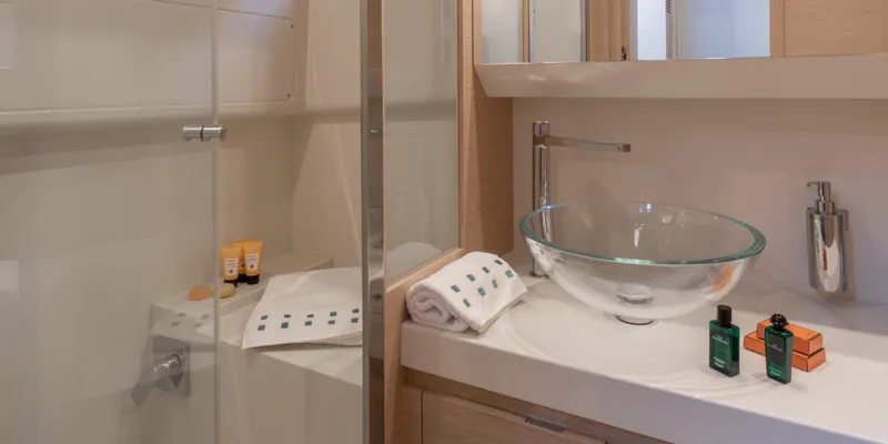 Slide: The Image of Modern bathroom on Solaris Power 44 Open yacht, 2025 model, featuring glass sink and shower. - 18