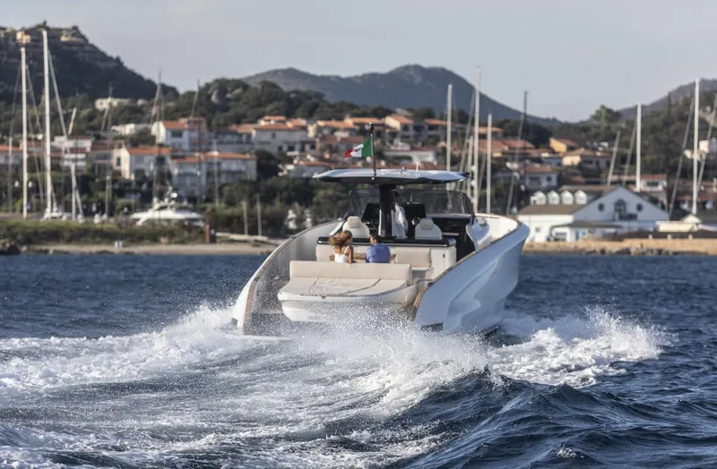 Slide: The Image of 2025 Solaris Power 44 Open yacht cruising near coastal town. - 4