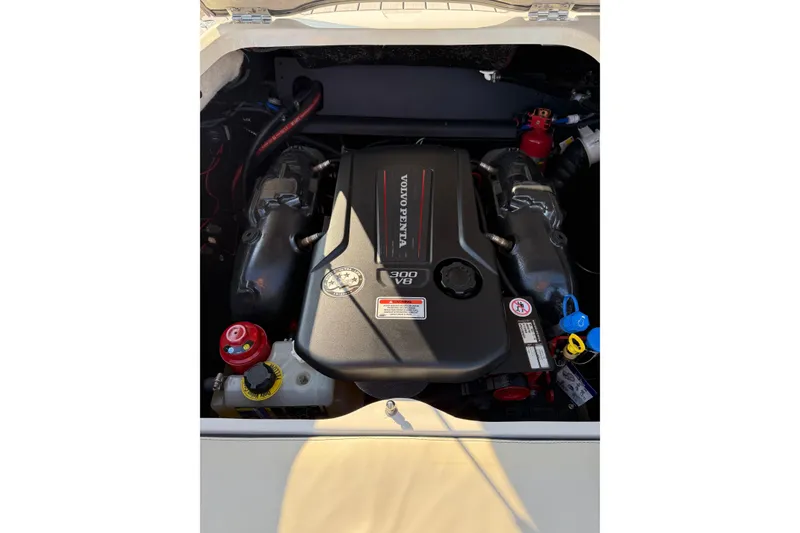 Slide: The Image of Engine compartment of a 2022 Stingray 235 LR boat featuring a Volvo Penta V8 engine. - 10