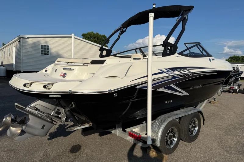 Slide: The Image of 2022 Stingray 235 LR boat on trailer, featuring sleek design and modern features. - 29