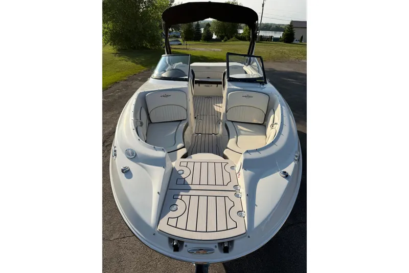 Slide: The Image of 2022 Stingray 235 LR boat with spacious seating and sleek design. - 33