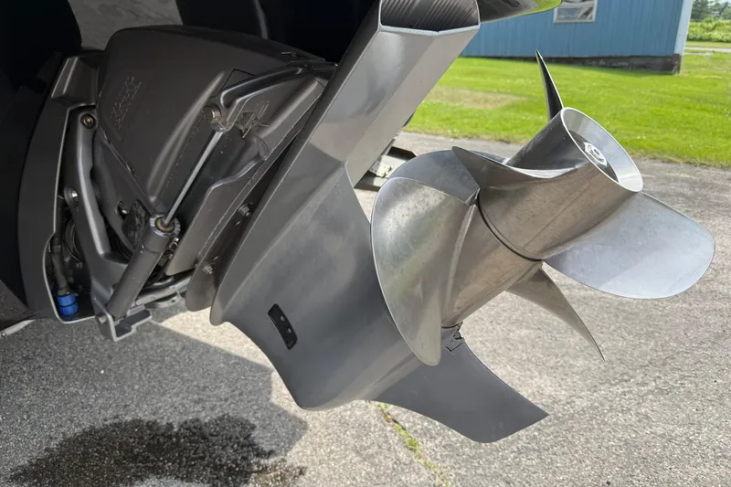 Slide: The Image of Close-up of a 2022 Stingray 235 LR boat propeller on pavement. - 7