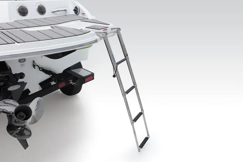 Slide: The Image of 2023 Tahoe 210 Si Limited boat with extended swim ladder and propeller. - 10