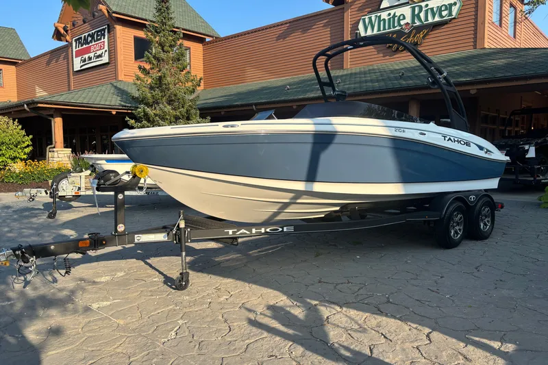 Slide: The Image of 2023 Tahoe 210 Si Limited boat on trailer outside White River shop. - 2
